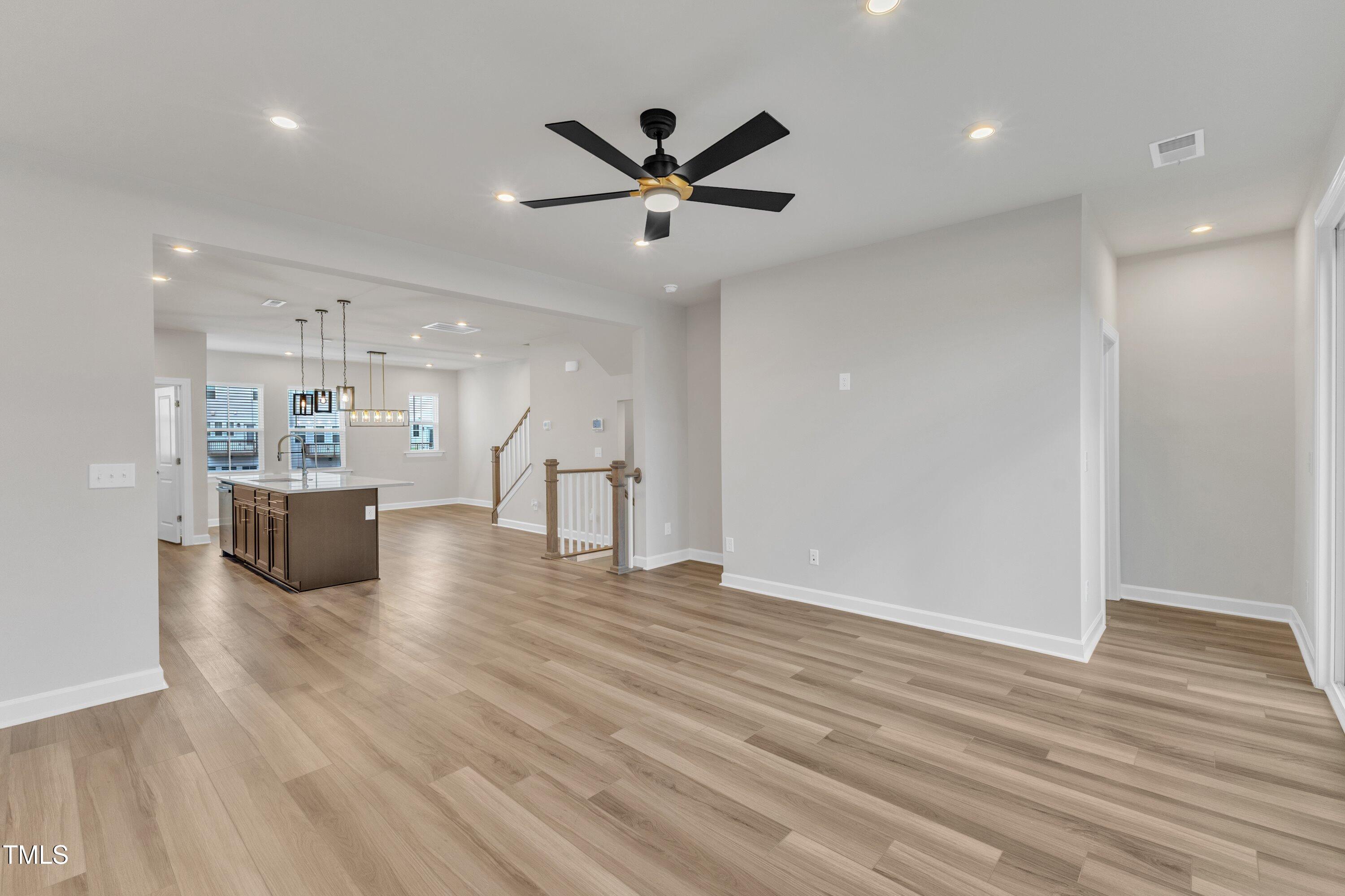 816 Lilyquist Way Wake Forest, NC 27587 - Photo 14 of 53 a view of a livingroom with a hardwood floor