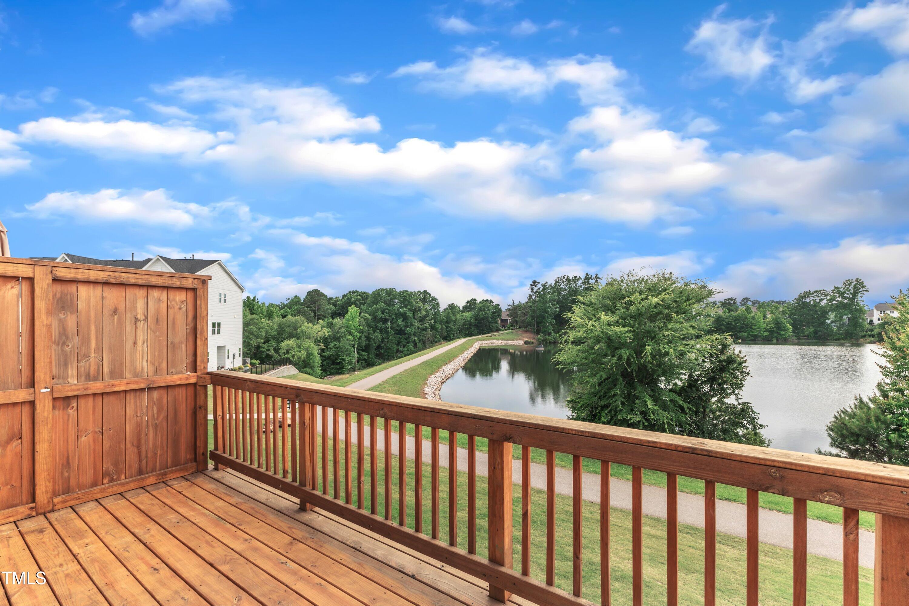 816 Lilyquist Way Wake Forest, NC 27587 - Photo 2 of 53 a view of a balcony with wooden floor & fence