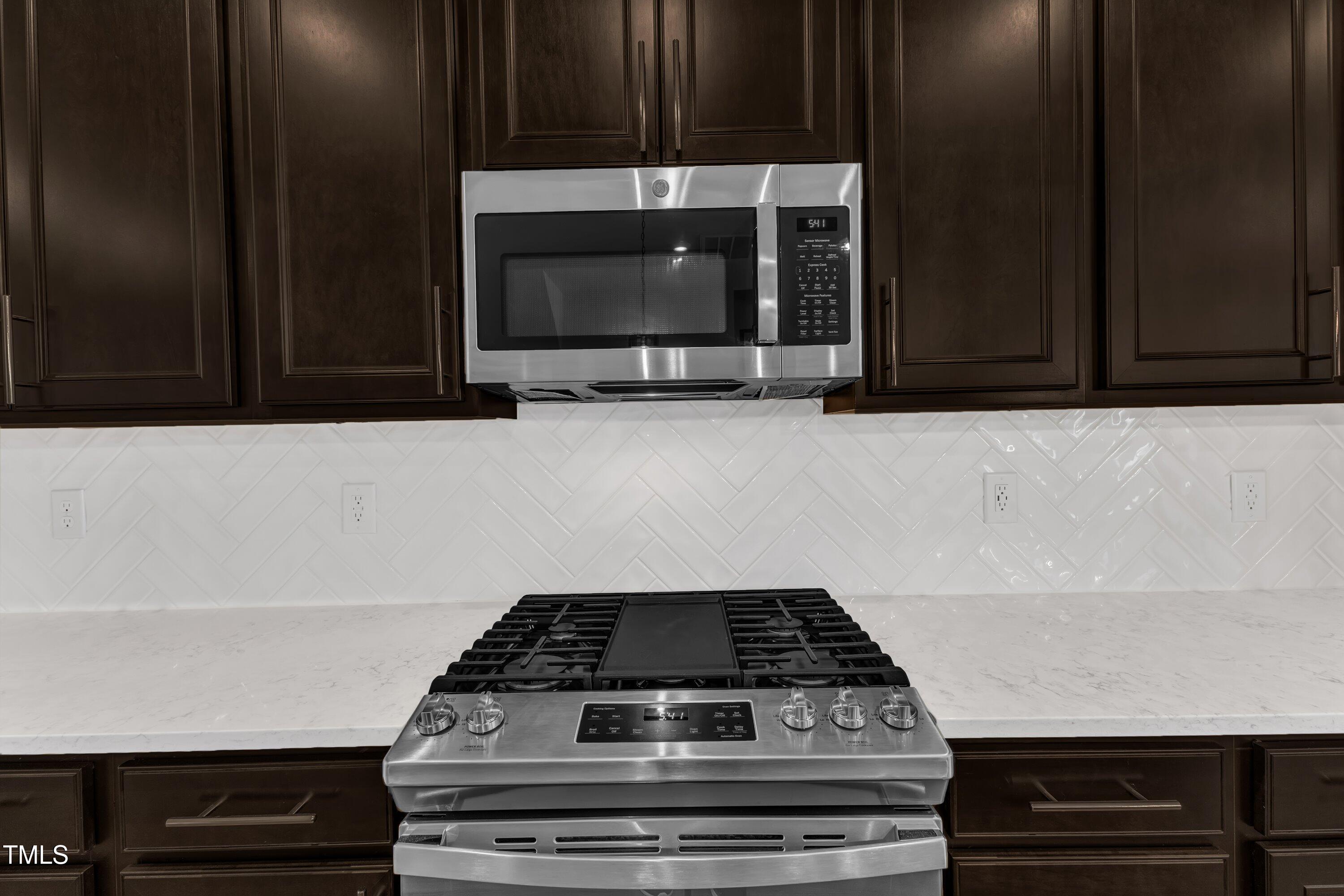 816 Lilyquist Way Wake Forest, NC 27587 - Photo 23 of 53 a stove top oven sitting inside of a kitchen