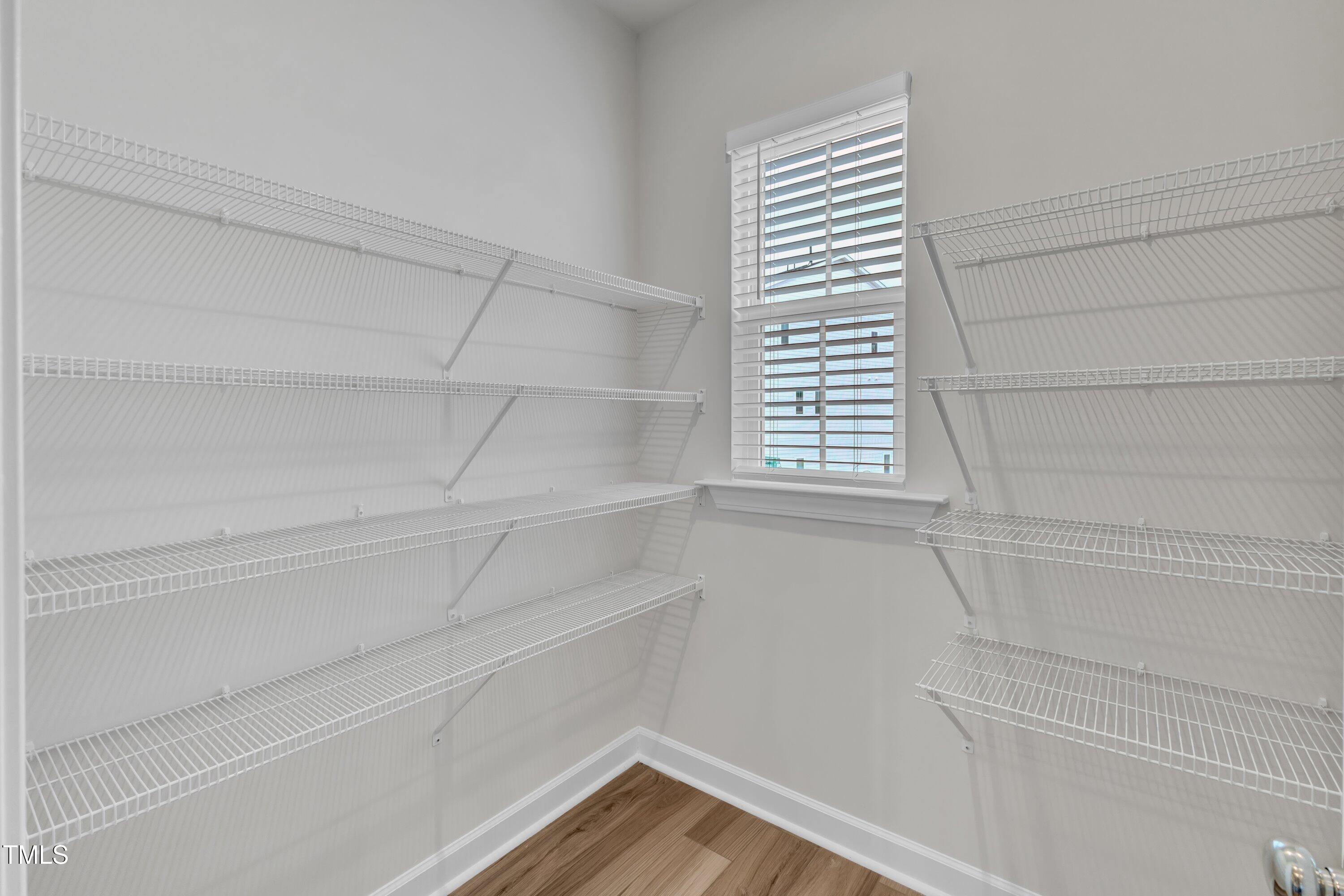 816 Lilyquist Way Wake Forest, NC 27587 - Photo 26 of 53 a view of a closet area with empty racks