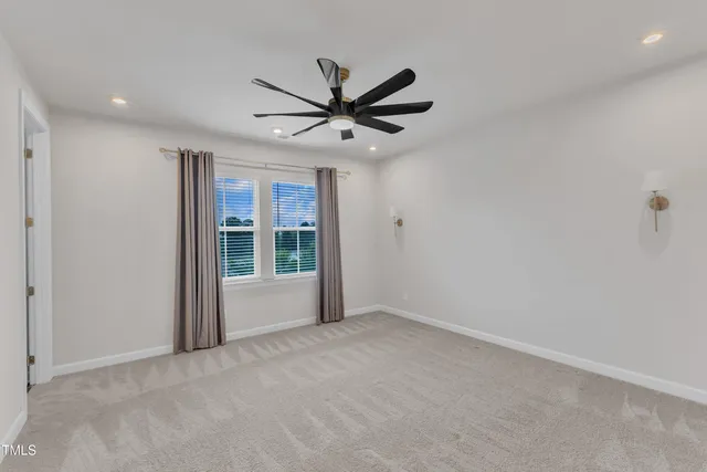 a spacious bathroom with a double vanity sink a mirror and a shower