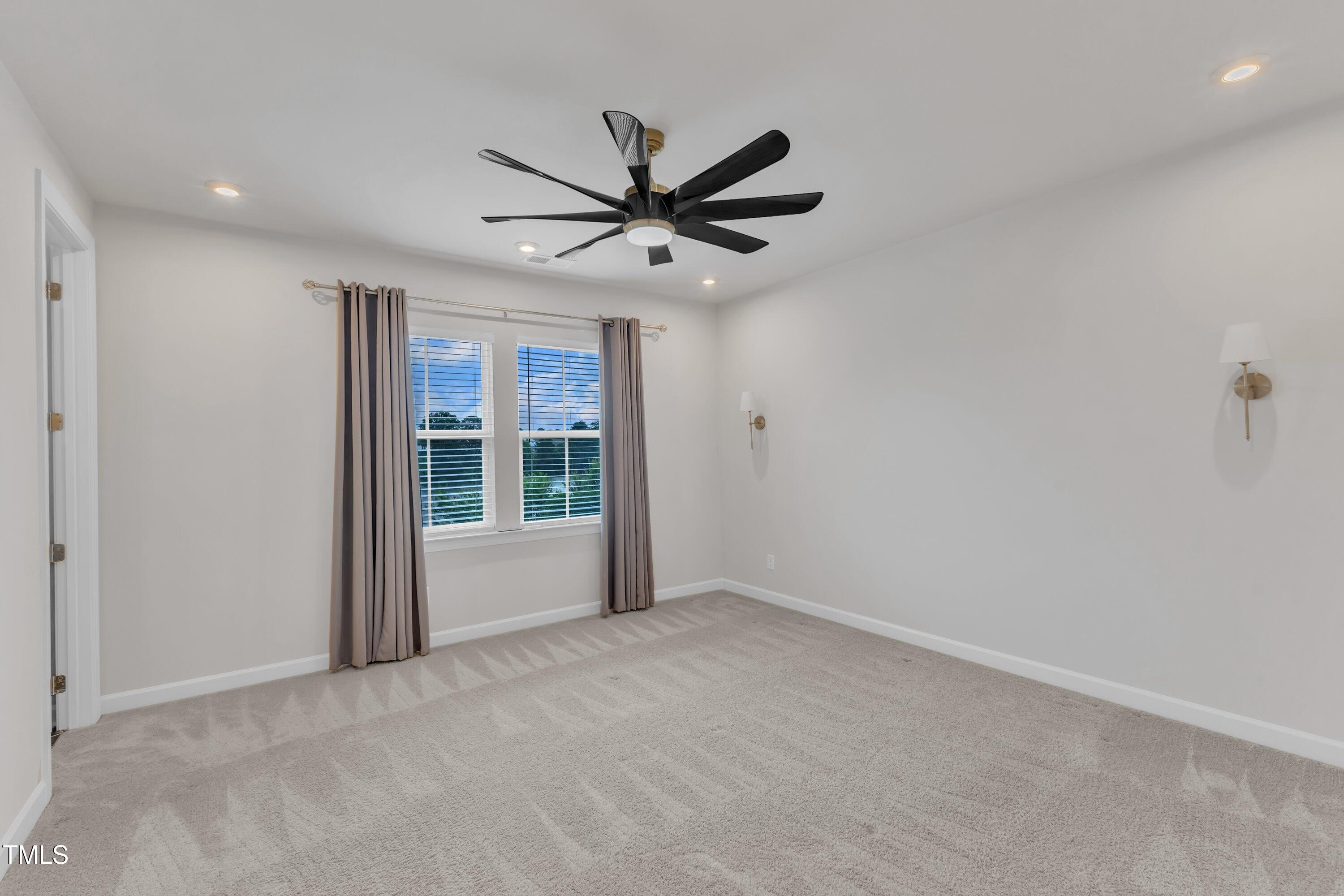 816 Lilyquist Way Wake Forest, NC 27587 - Photo 30 of 53 a view of an empty room with a window
