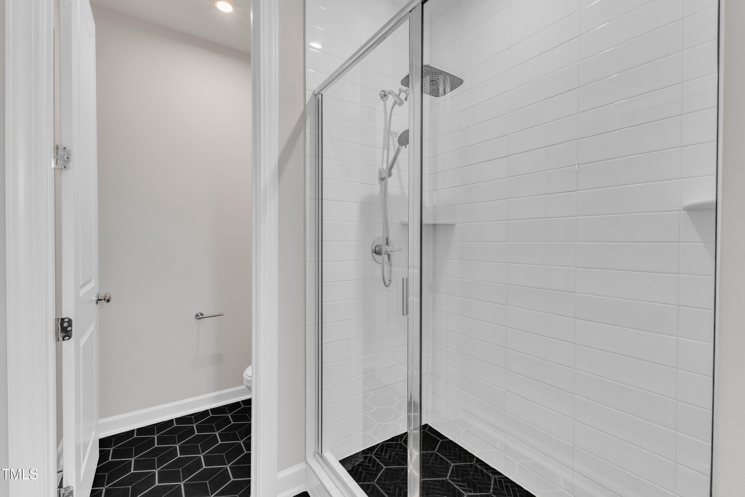 816 Lilyquist Way Wake Forest, NC 27587 - Photo 32 of 53 a bathroom with a shower