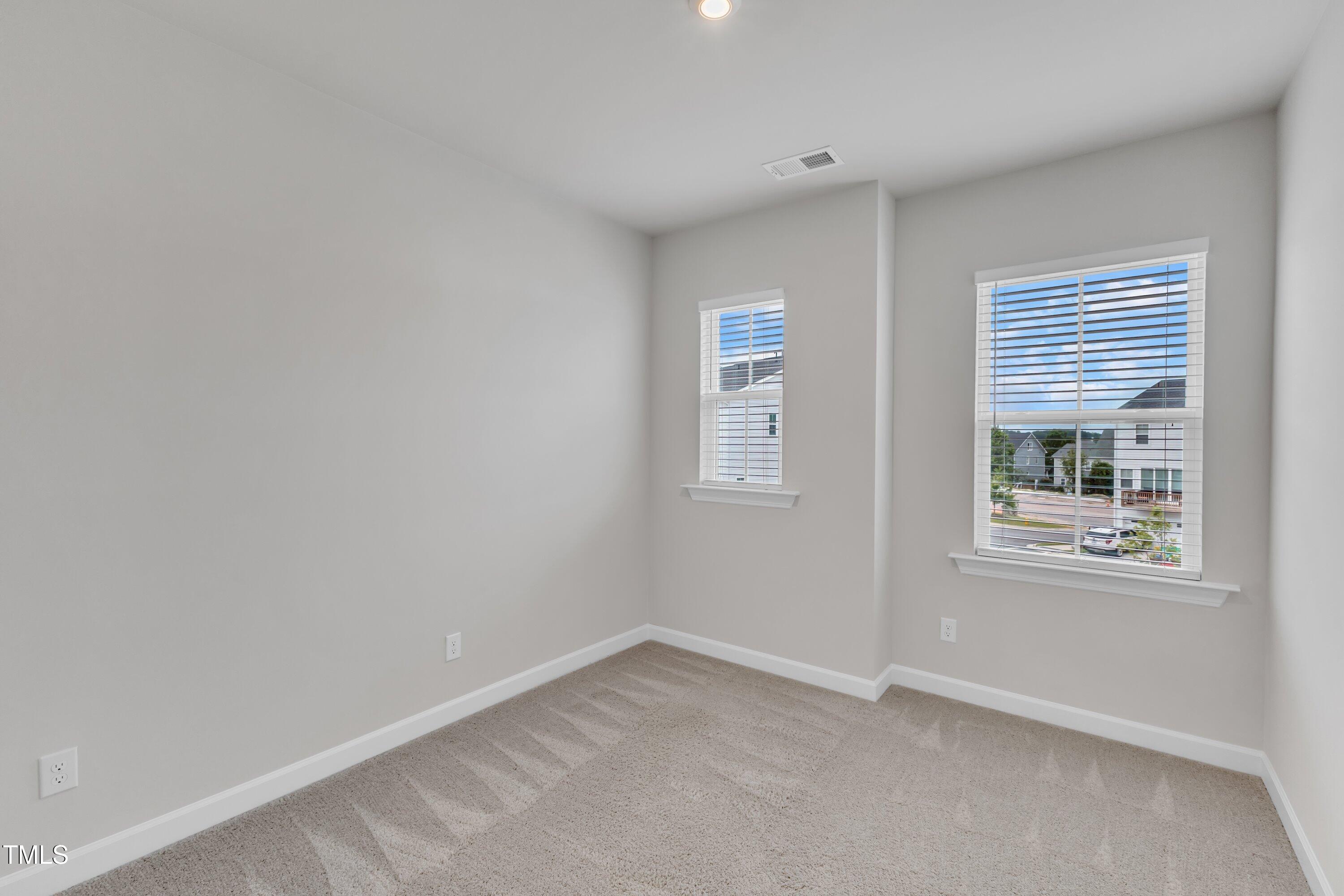 816 Lilyquist Way Wake Forest, NC 27587 - Photo 33 of 53 an empty room with windows