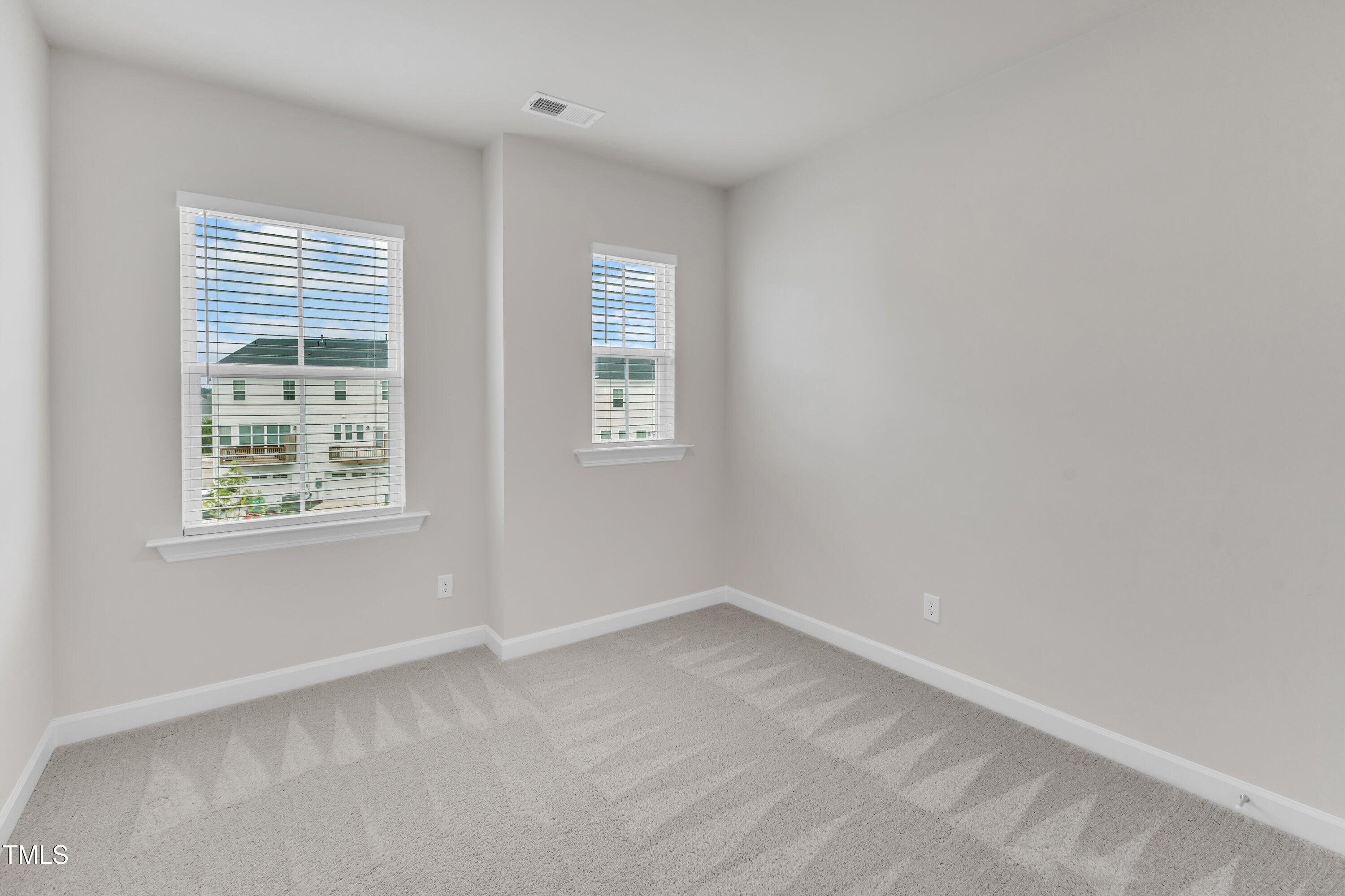 816 Lilyquist Way Wake Forest, NC 27587 - Photo 35 of 53 an empty room with a window