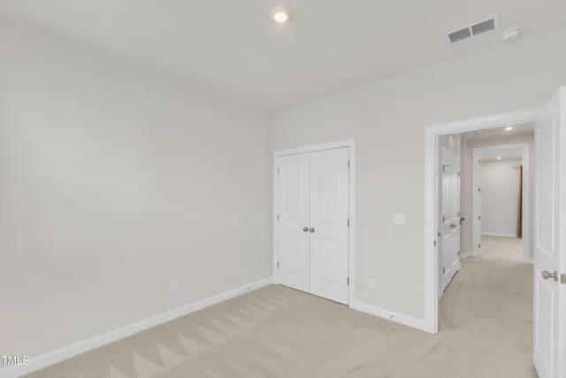a bathroom with a sink toilet vanity and shower