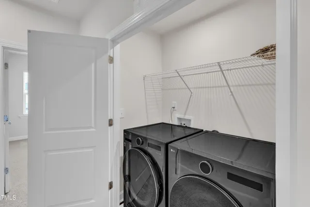 a front view of building with yard and outdoor seating