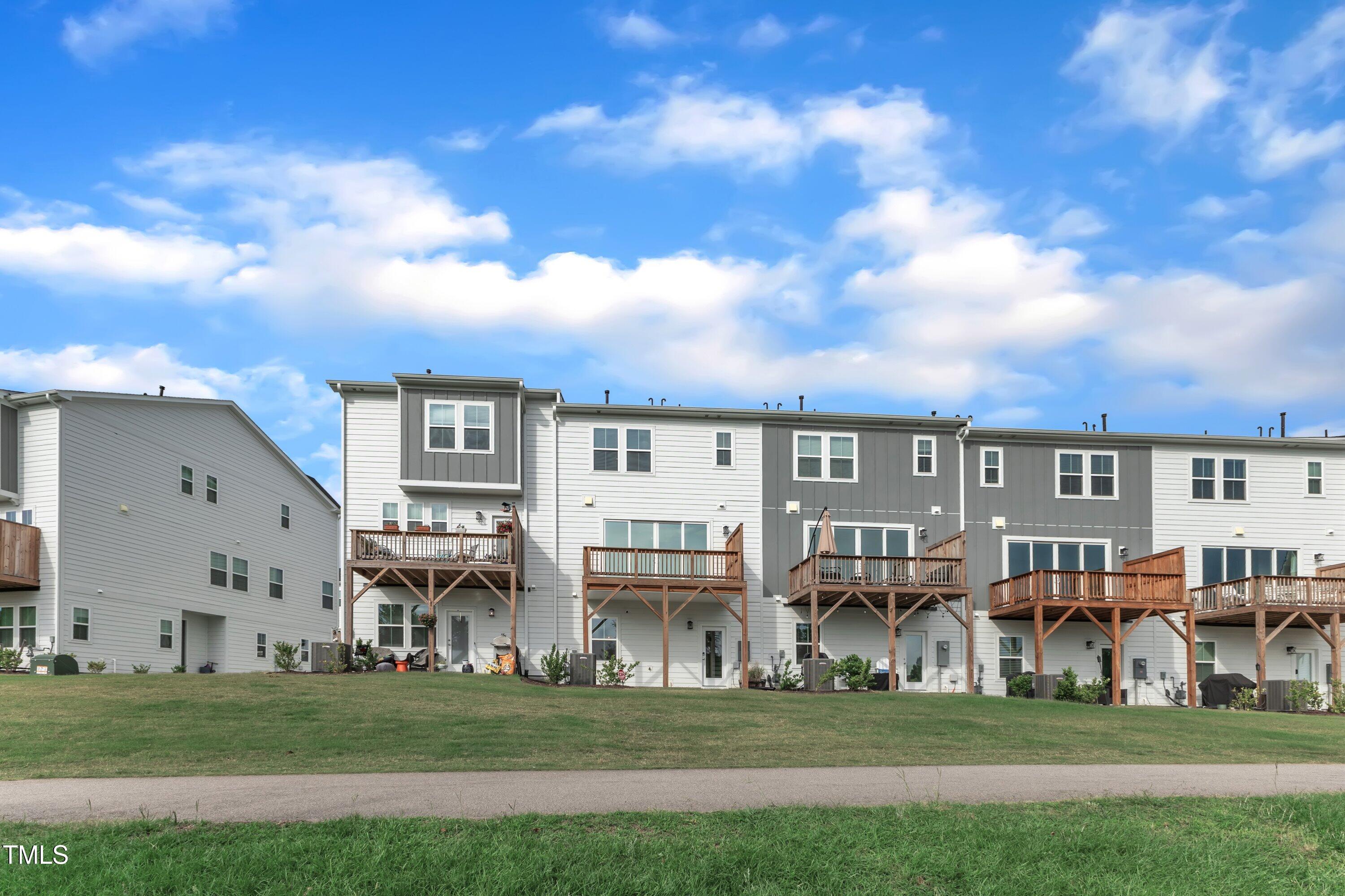 816 Lilyquist Way Wake Forest, NC 27587 - Photo 39 of 53 a front view of building with yard and outdoor seating