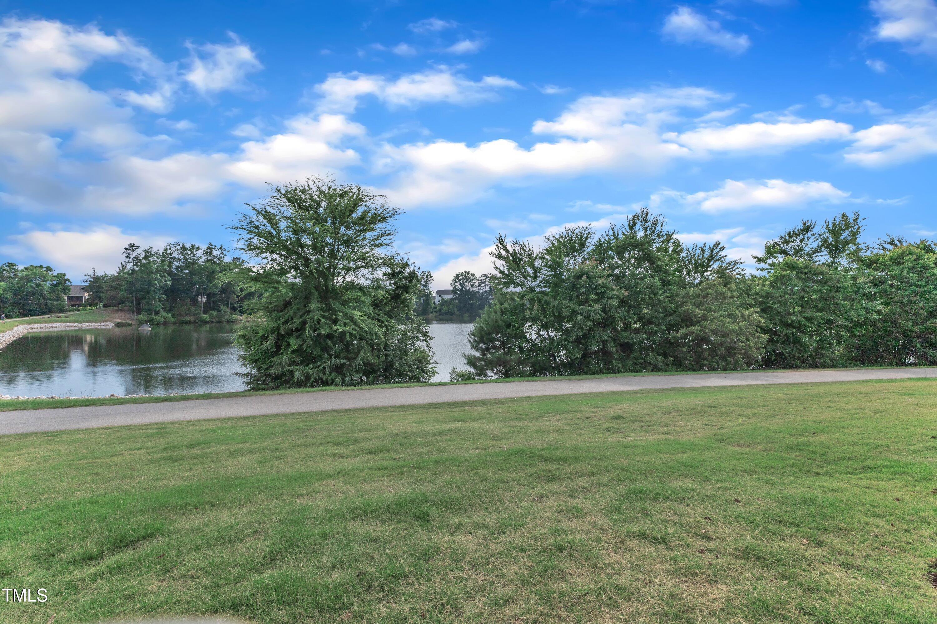 816 Lilyquist Way Wake Forest, NC 27587 - Photo 40 of 53 a view of a lake with a yard