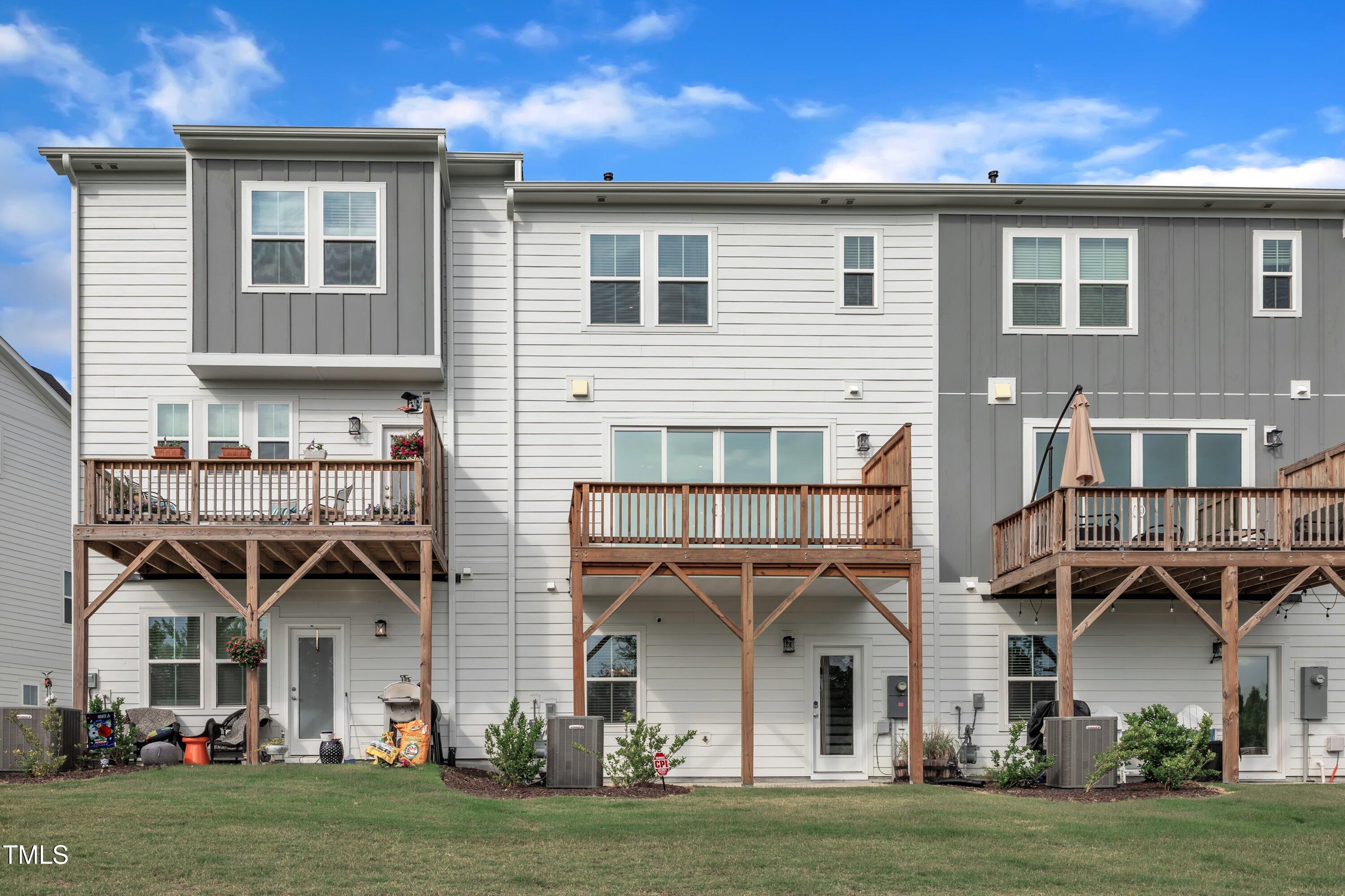 816 Lilyquist Way Wake Forest, NC 27587 - Photo 44 of 53 a front view of a house with a garden