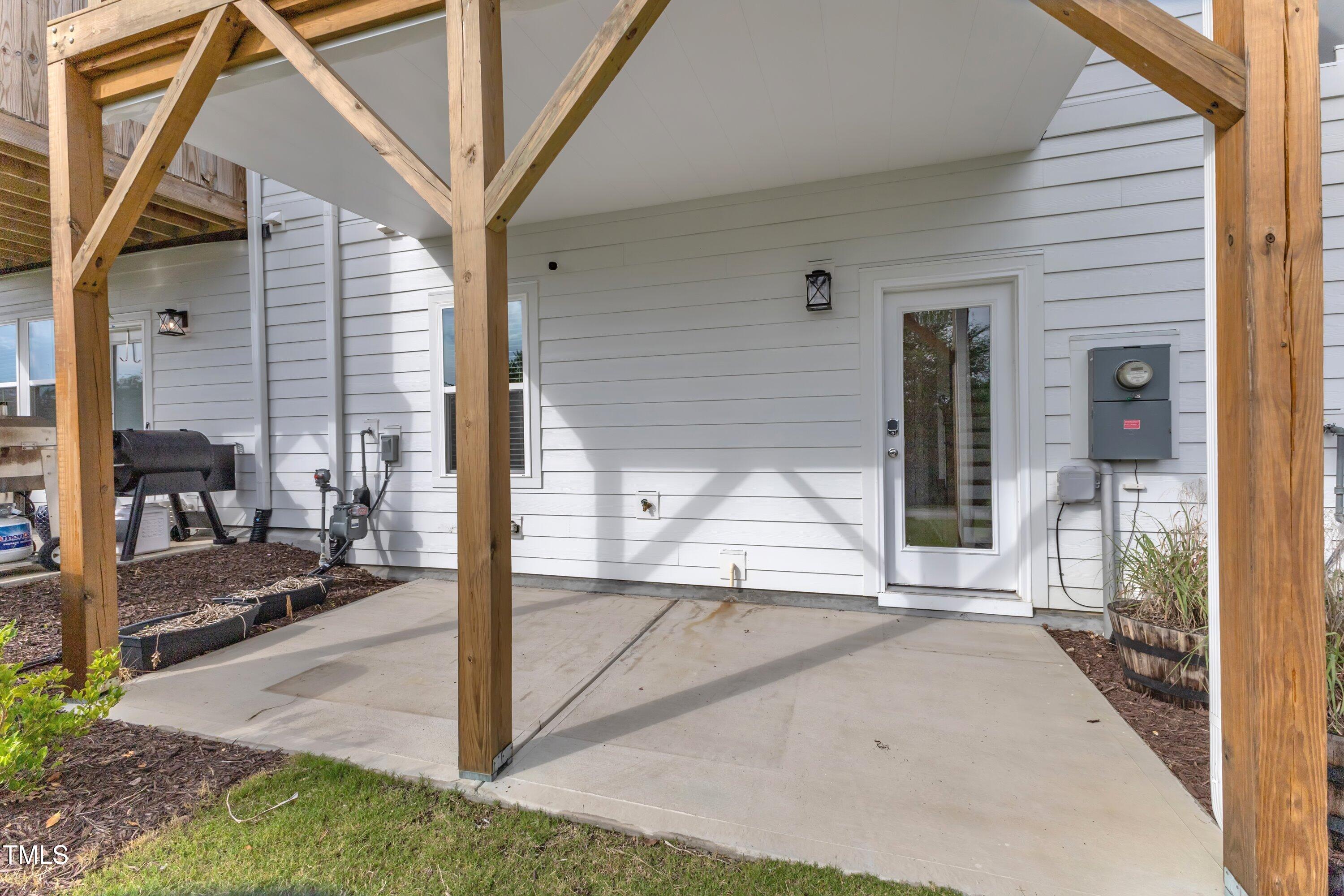 816 Lilyquist Way Wake Forest, NC 27587 - Photo 46 of 53 a view of a porch with a table and chairs
