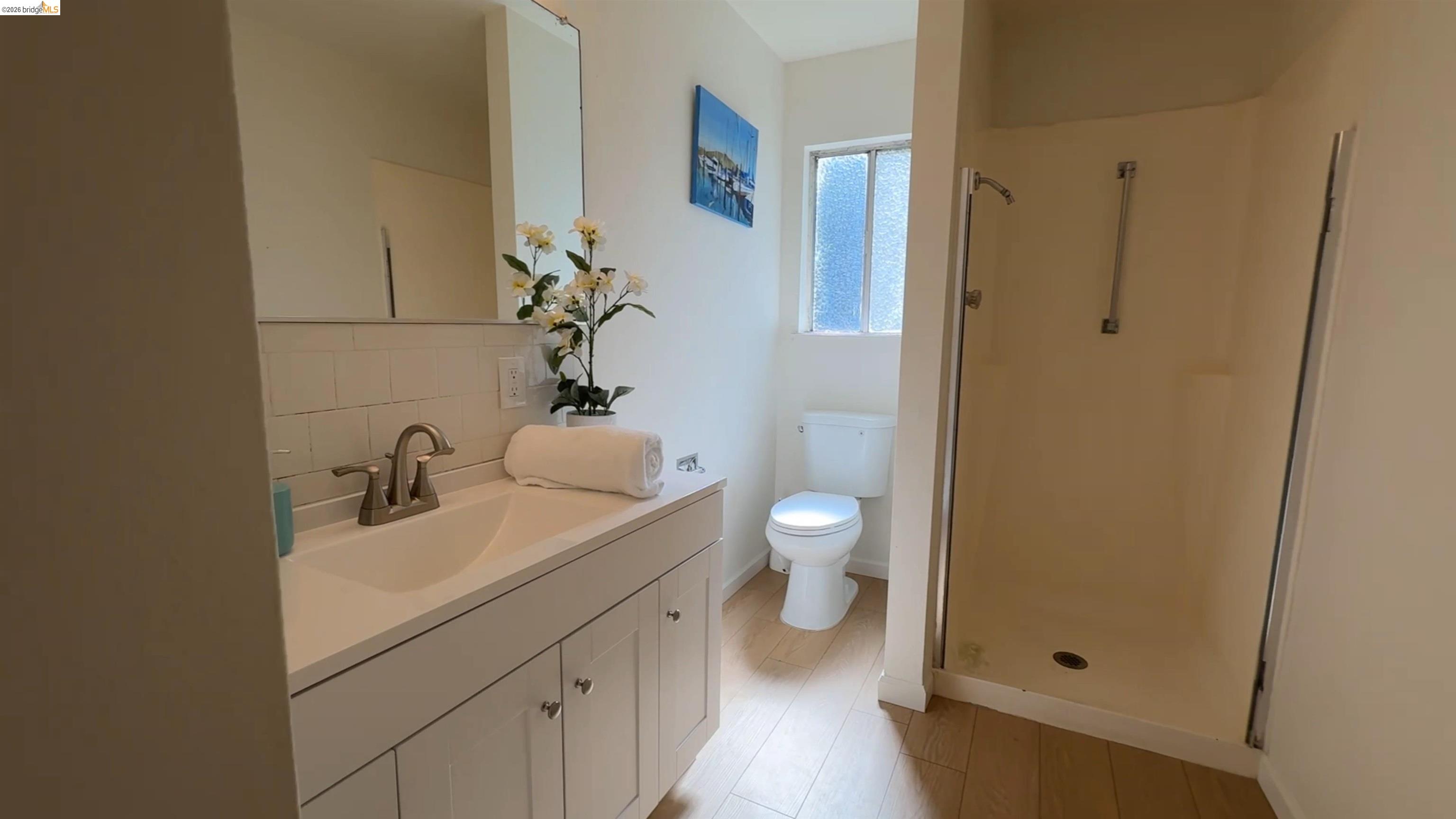 5051 Harrison Grade Road Sebastopol, CA 95472 - Photo 11 of 31 a bathroom with a sink and a toilet