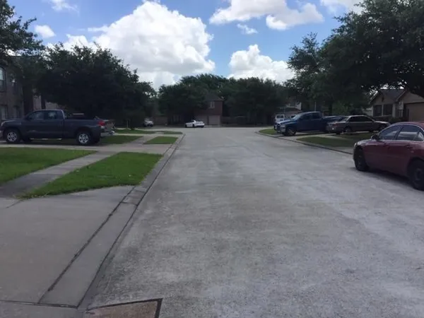 a view of street with parked cars