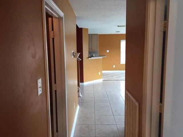 a view of a bathroom from a hallway