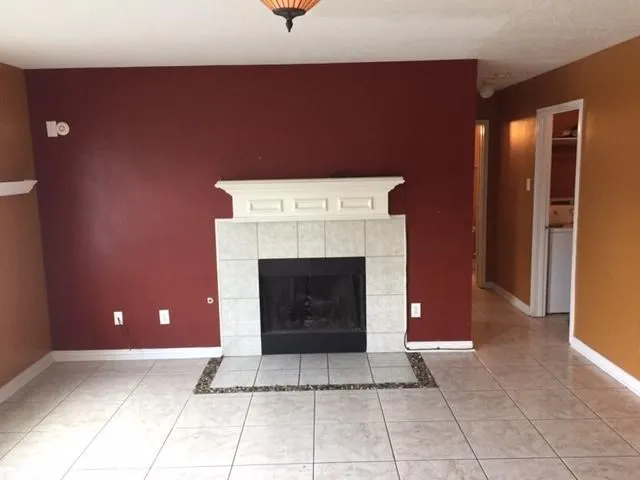 a living room with a fireplace