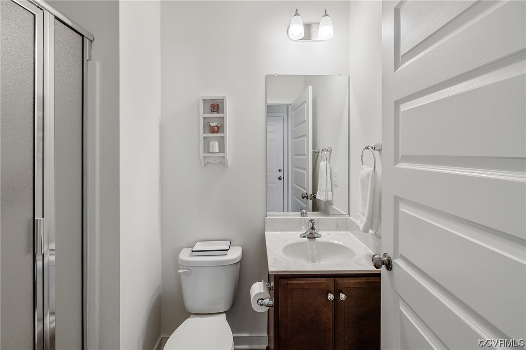8125 Timberstone Drive Chesterfield, VA 23832 - Photo 19 of 34 a bathroom with a sink a toilet and shower