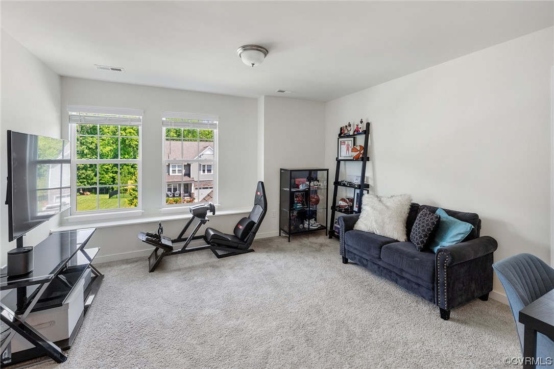 8125 Timberstone Drive Chesterfield, VA 23832 - Photo 21 of 34 a living room with furniture and a flat screen tv
