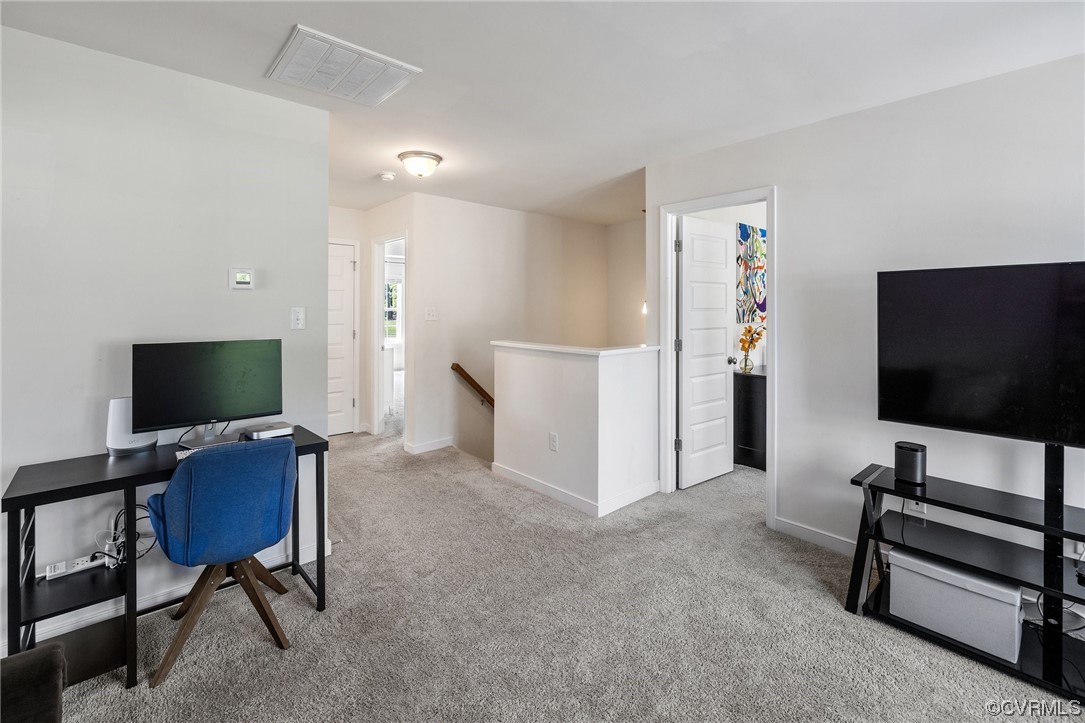 8125 Timberstone Drive Chesterfield, VA 23832 - Photo 22 of 34 a living room with furniture and a flat screen tv