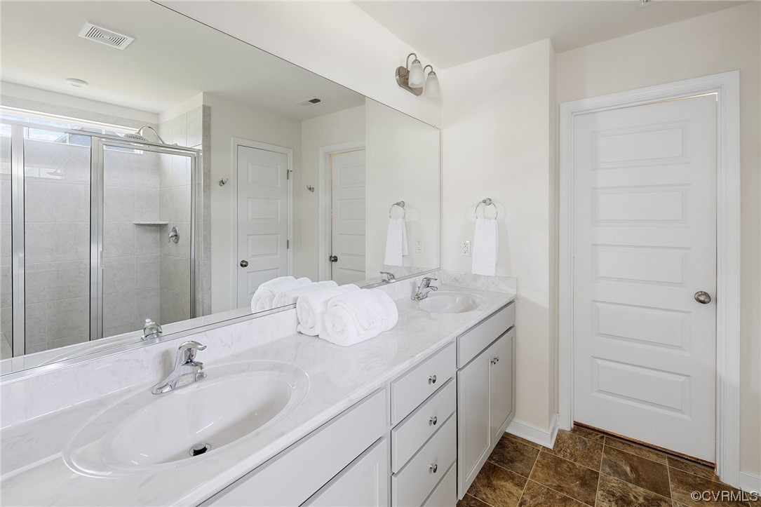 8125 Timberstone Drive Chesterfield, VA 23832 - Photo 30 of 34 a bathroom with double vanity sink and mirror