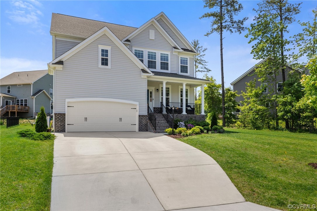 8125 Timberstone Drive Chesterfield, VA 23832 - Photo 3 of 34 a front view of a house with a yard and potted plants