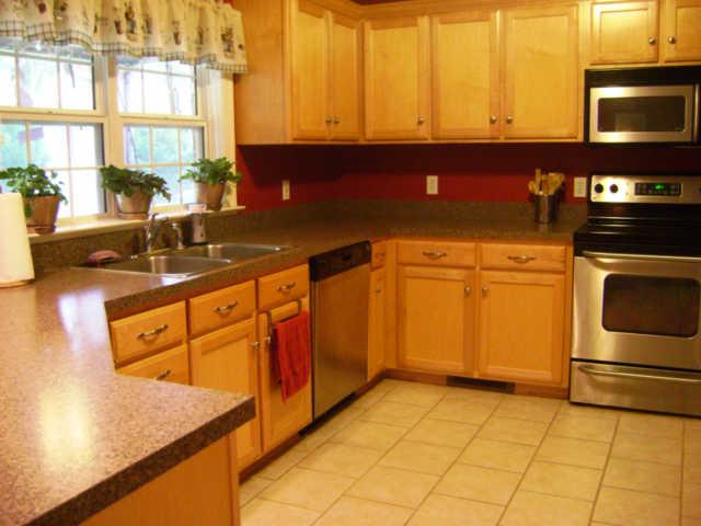 836 Holt Road Lebanon, TN 37087 - Photo 5 of 16 Kitchen has stainless appliances, tile, and is open to dining area