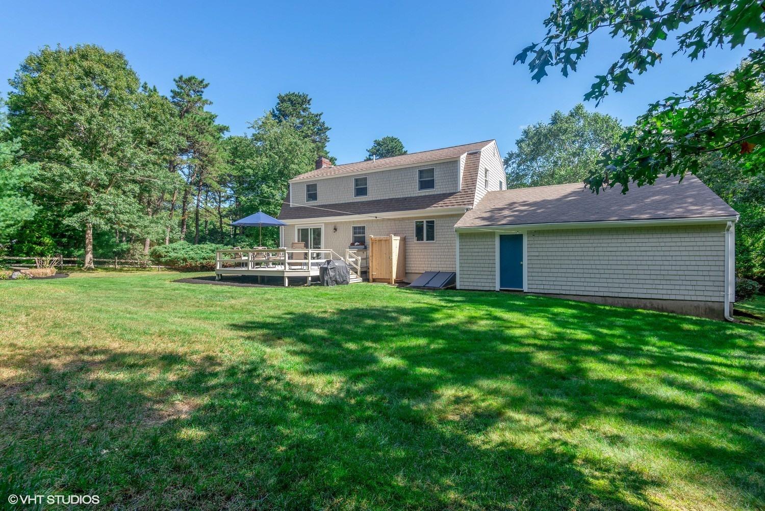 1166 Old Post Road Cotuit, MA 02635 - Photo 15 of 15 a view of a house with a yard tree and sitting area