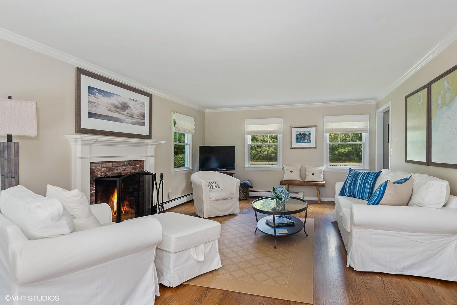 1166 Old Post Road Cotuit, MA 02635 - Photo 4 of 15 a living room with furniture fireplace and window