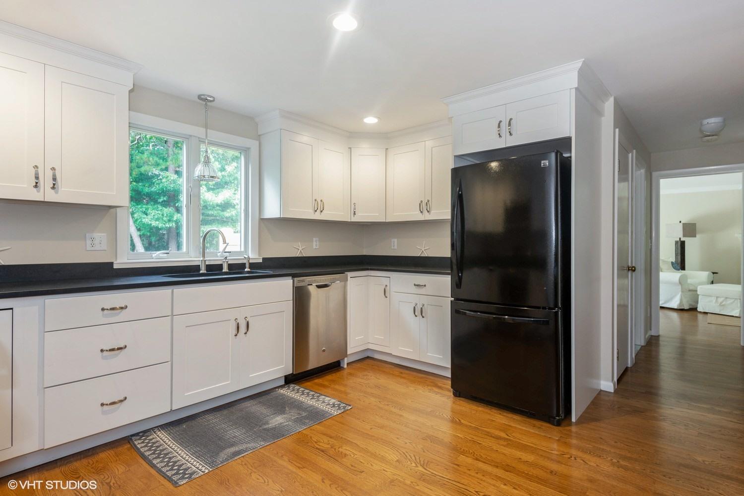 1166 Old Post Road Cotuit, MA 02635 - Photo 6 of 15 a kitchen with granite countertop a refrigerator and a sink