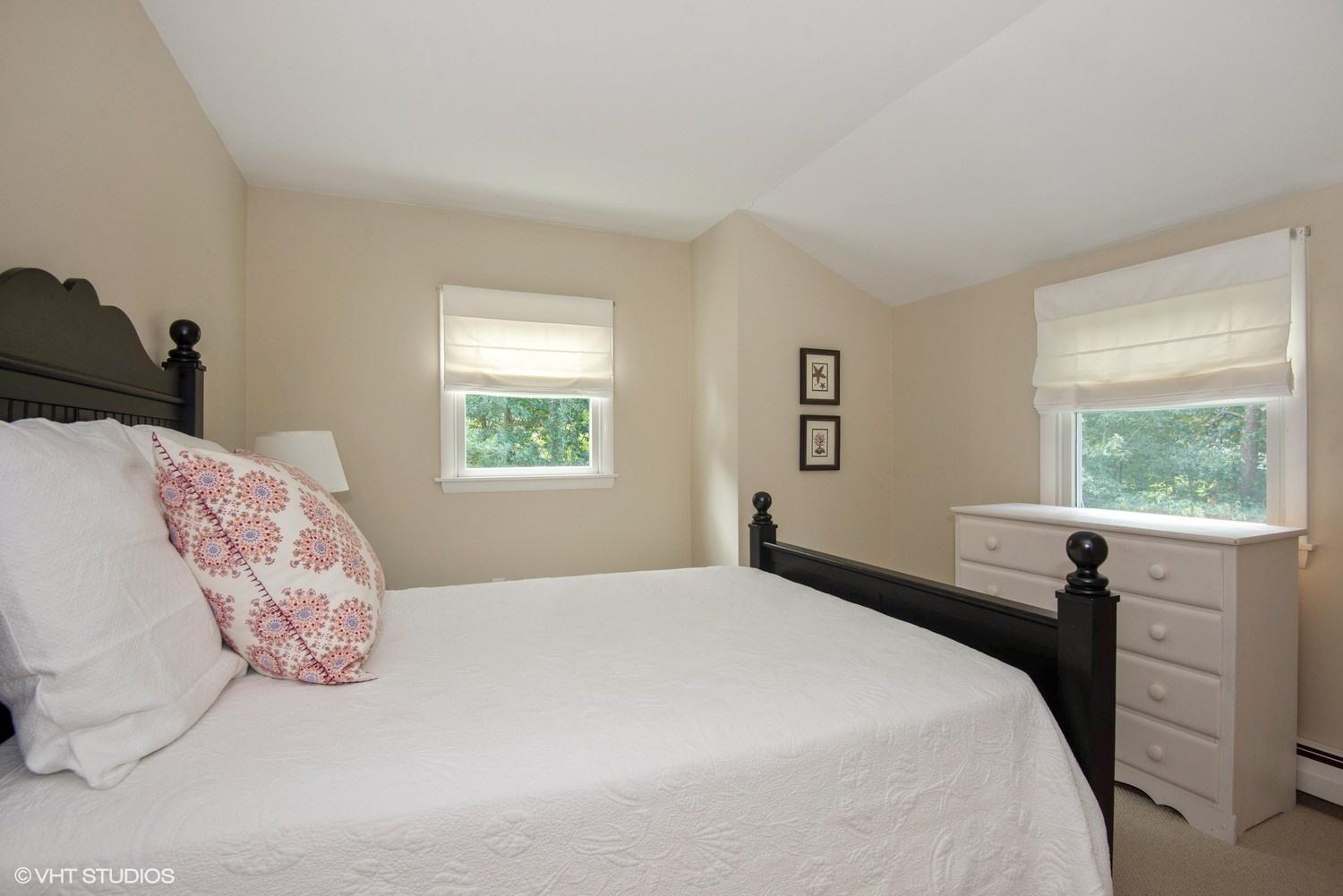 1166 Old Post Road Cotuit, MA 02635 - Photo 9 of 15 a bedroom with a bed and a window