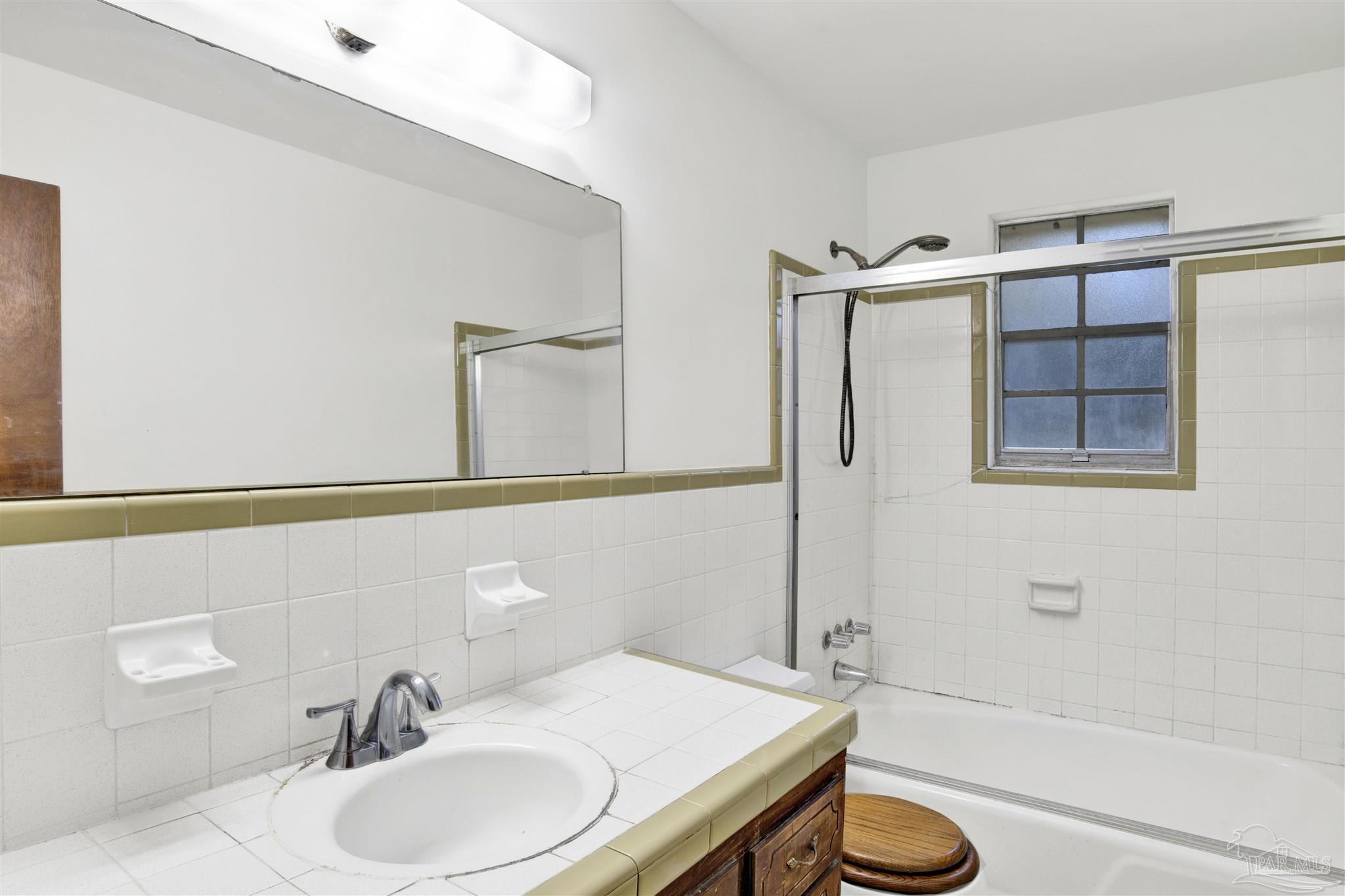 9621 Sidney Road Pensacola, FL 32507 - Photo 19 of 30 a bathroom with a sink toilet and shower