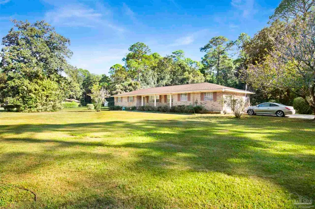 a view of swimming pool and trees in the background