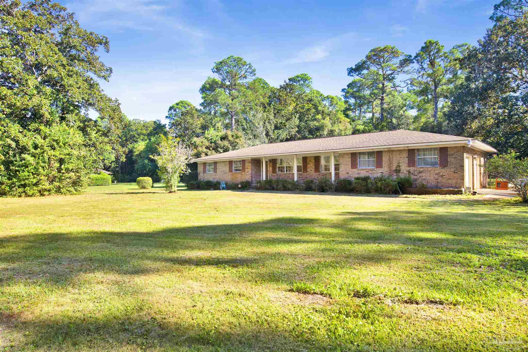 9621 Sidney Road Pensacola, FL 32507 - Photo 27 of 30 a view of a house with a swimming pool