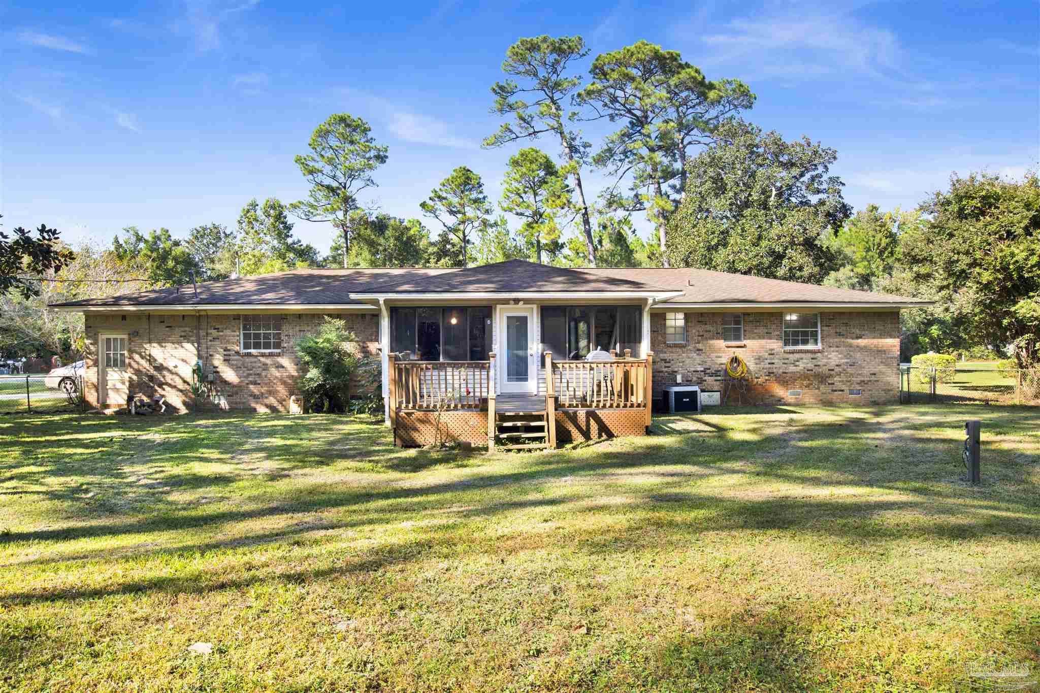 9621 Sidney Road Pensacola, FL 32507 - Photo 29 of 30 a view of a house with a yard patio and swimming pool