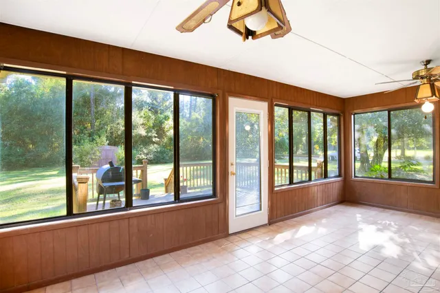 a view of empty room with windows and city view