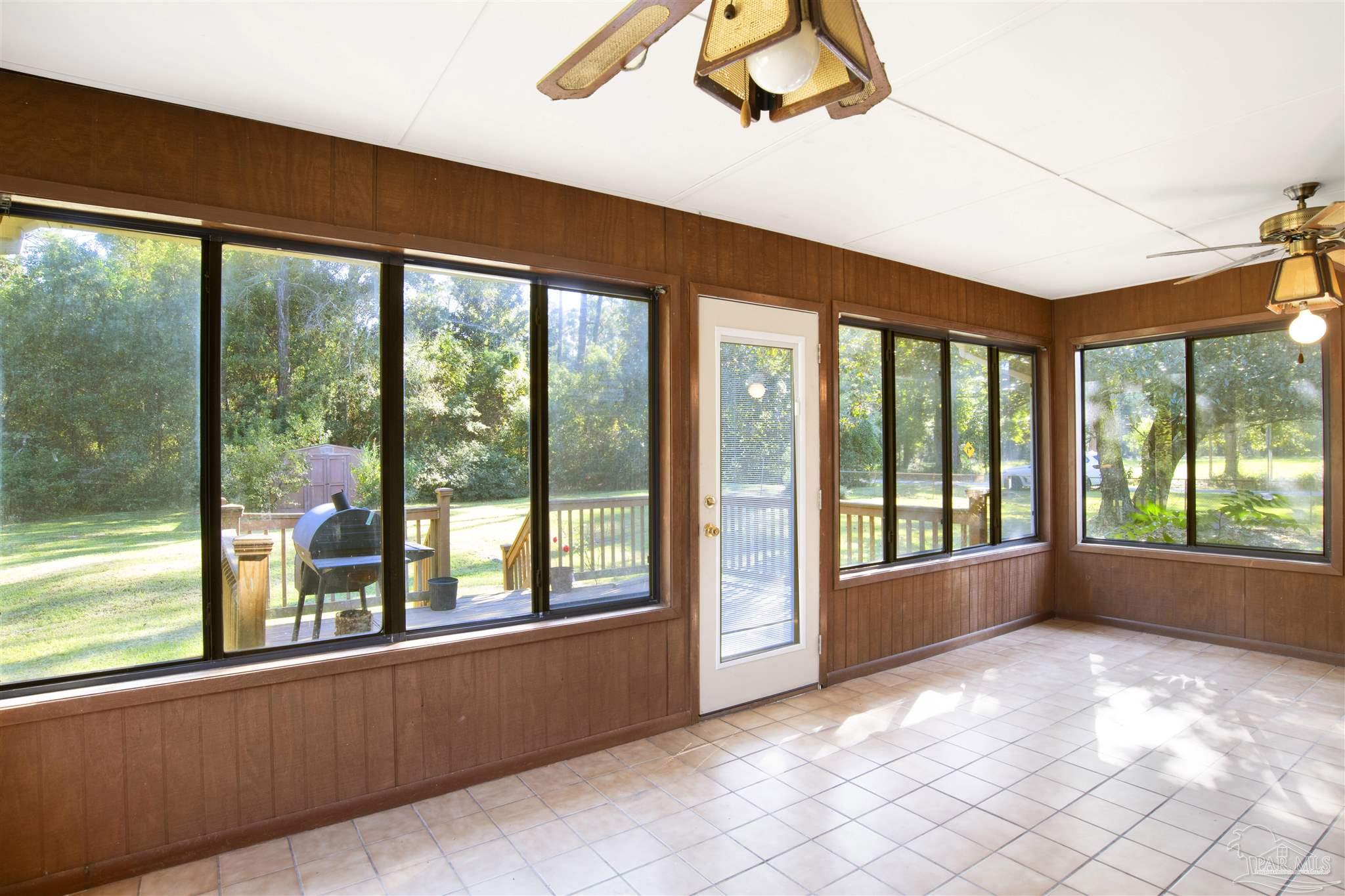 9621 Sidney Road Pensacola, FL 32507 - Photo 4 of 30 a view of empty room with windows and city view