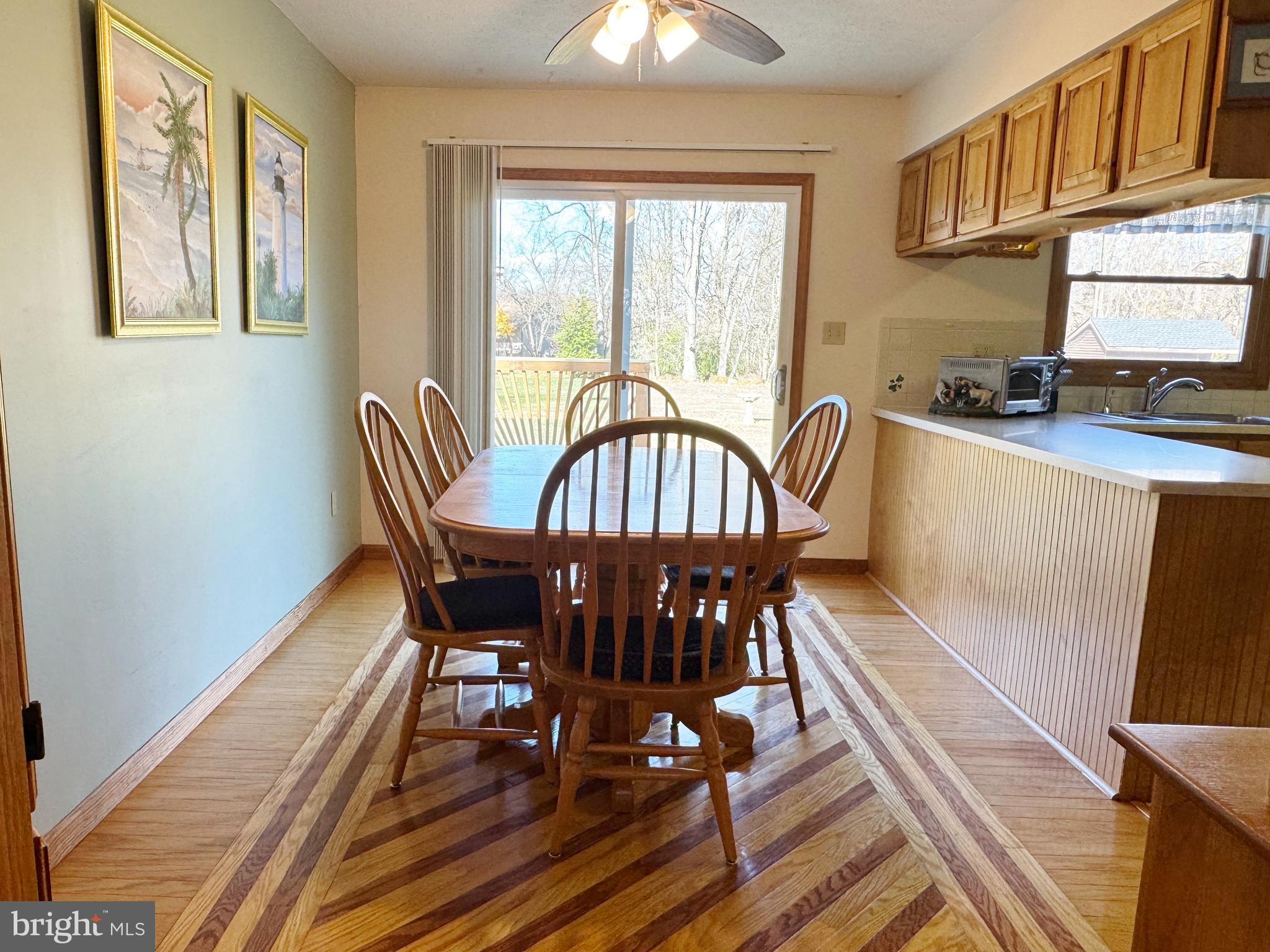 125 Brer Rabbit Road Rising Sun, MD 21911 - Photo 12 of 45 a view of a dining room with furniture window and wooden floor