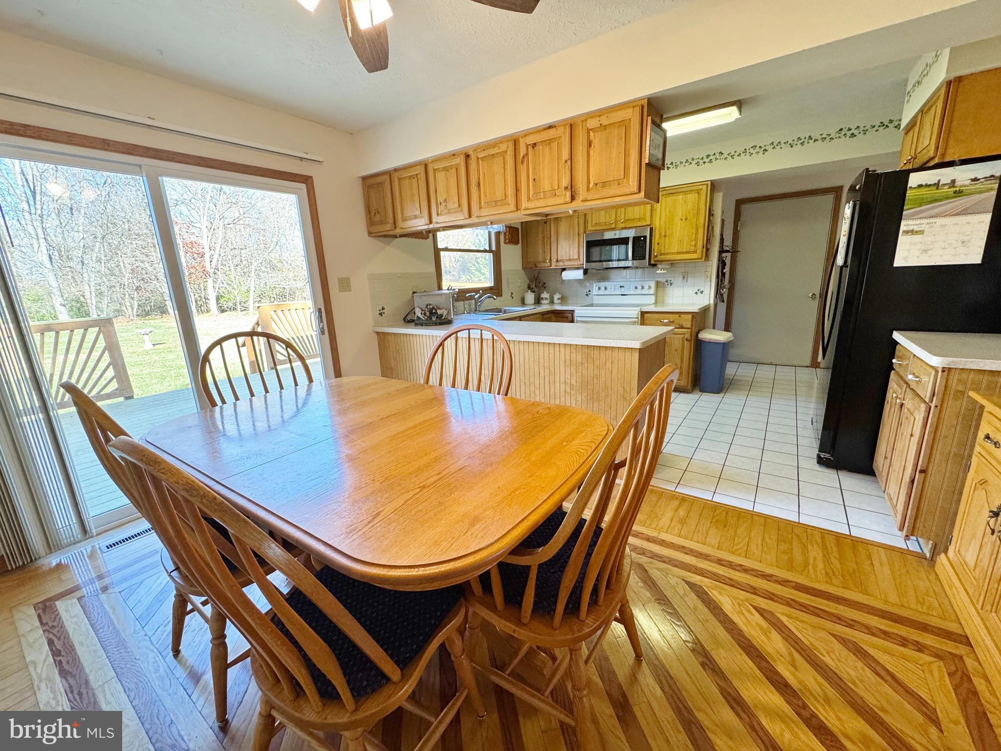 125 Brer Rabbit Road Rising Sun, MD 21911 - Photo 13 of 45 a dining room with furniture a window and wooden floor