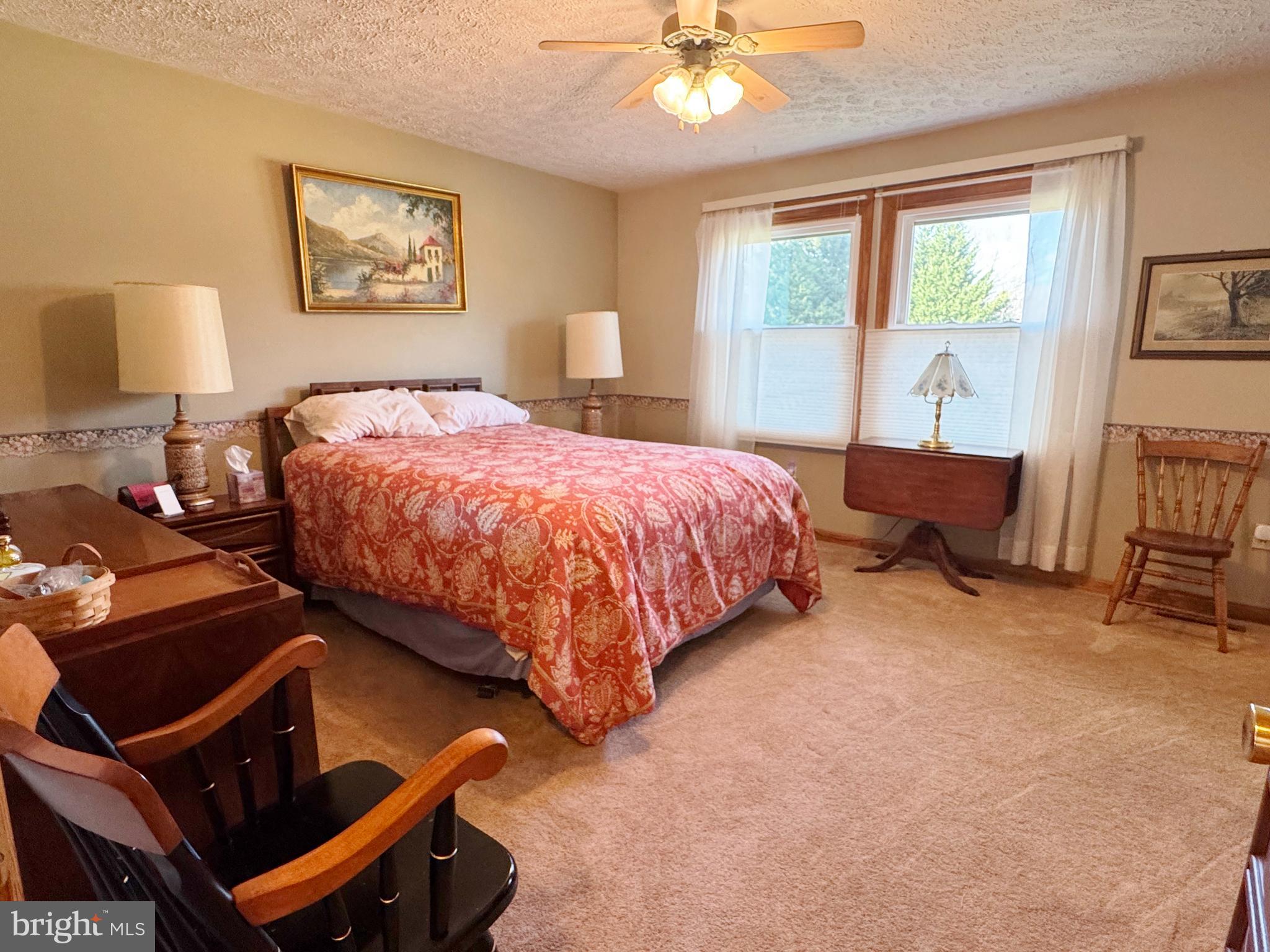 125 Brer Rabbit Road Rising Sun, MD 21911 - Photo 16 of 45 a spacious bedroom with a bed and a window
