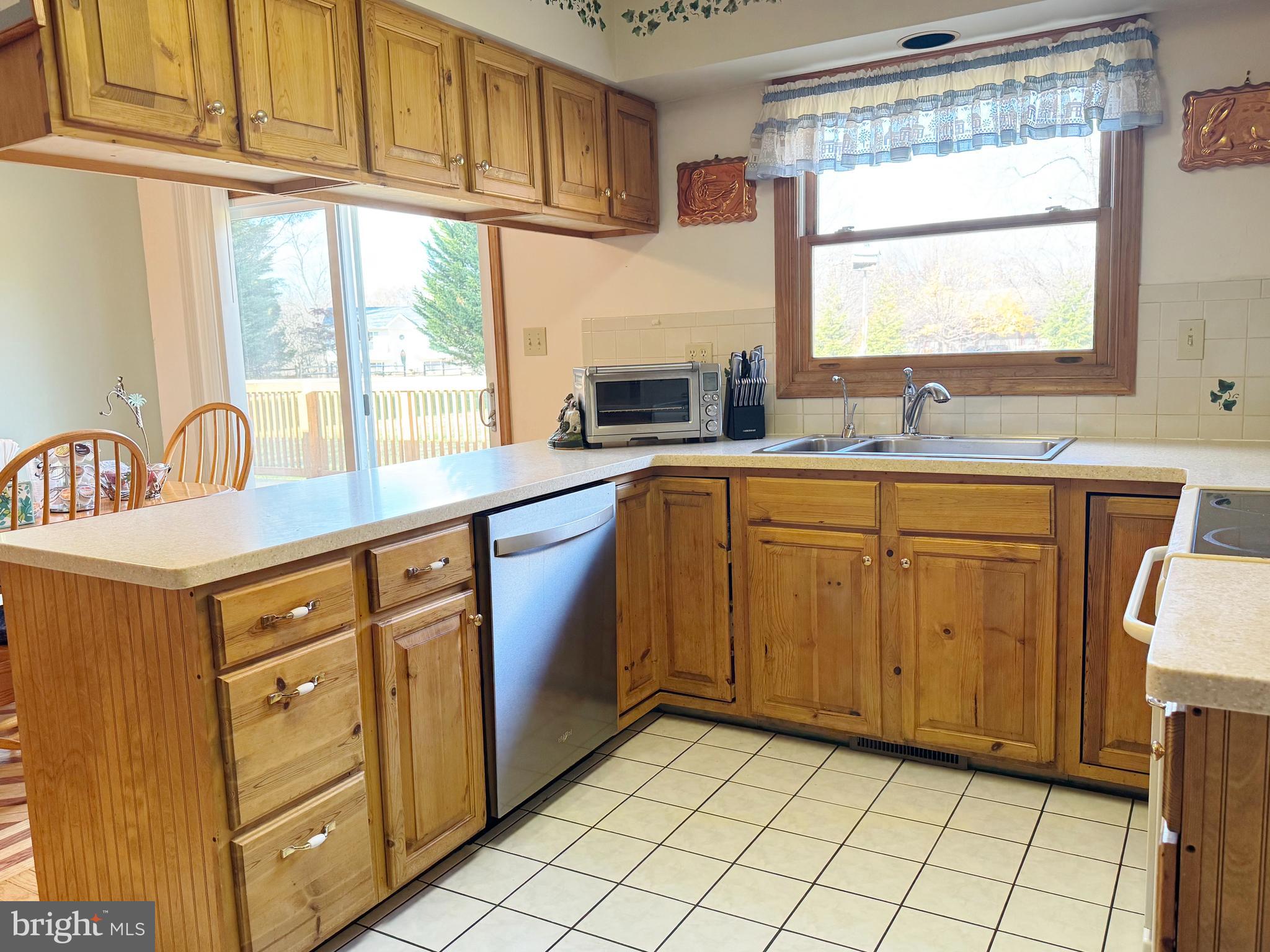 125 Brer Rabbit Road Rising Sun, MD 21911 - Photo 10 of 45 a kitchen with stainless steel appliances granite countertop a sink stove and cabinets