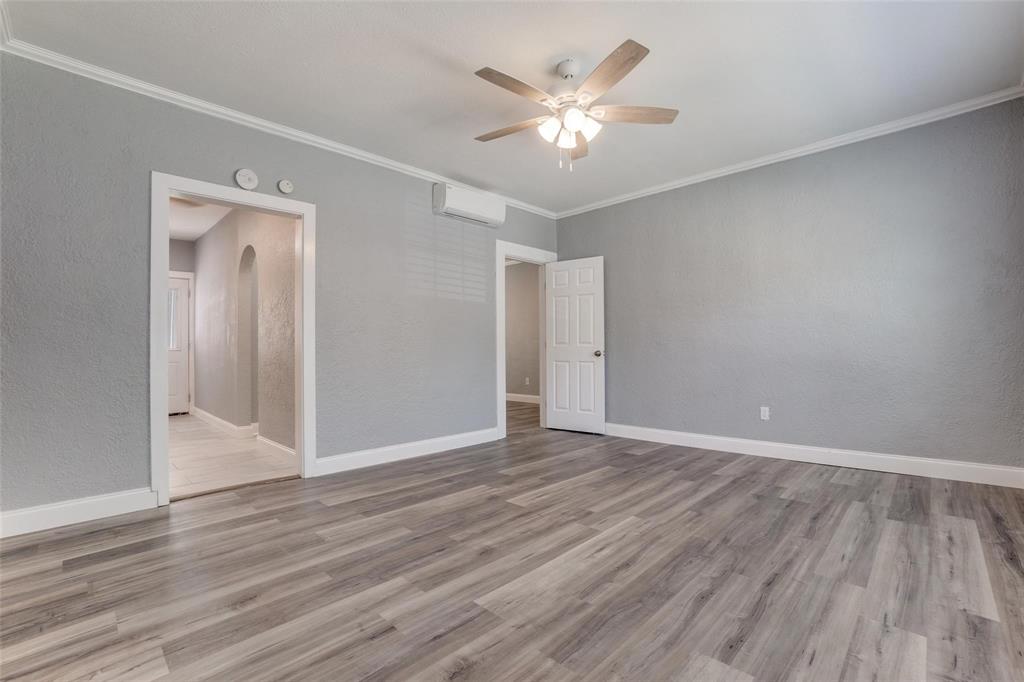 320 West Canty Street, Unit 2 Dallas, TX 75208 - Photo 3 of 11 a view of an empty room with wooden floor