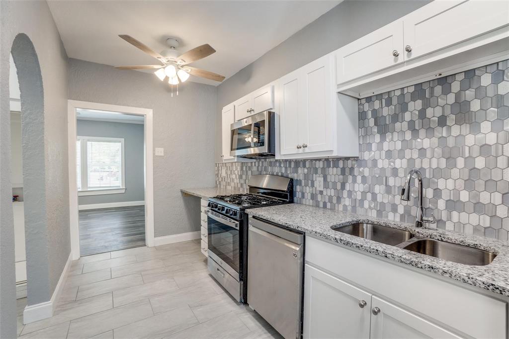 320 West Canty Street, Unit 2 Dallas, TX 75208 - Photo 7 of 11 a kitchen with a sink stove and cabinets