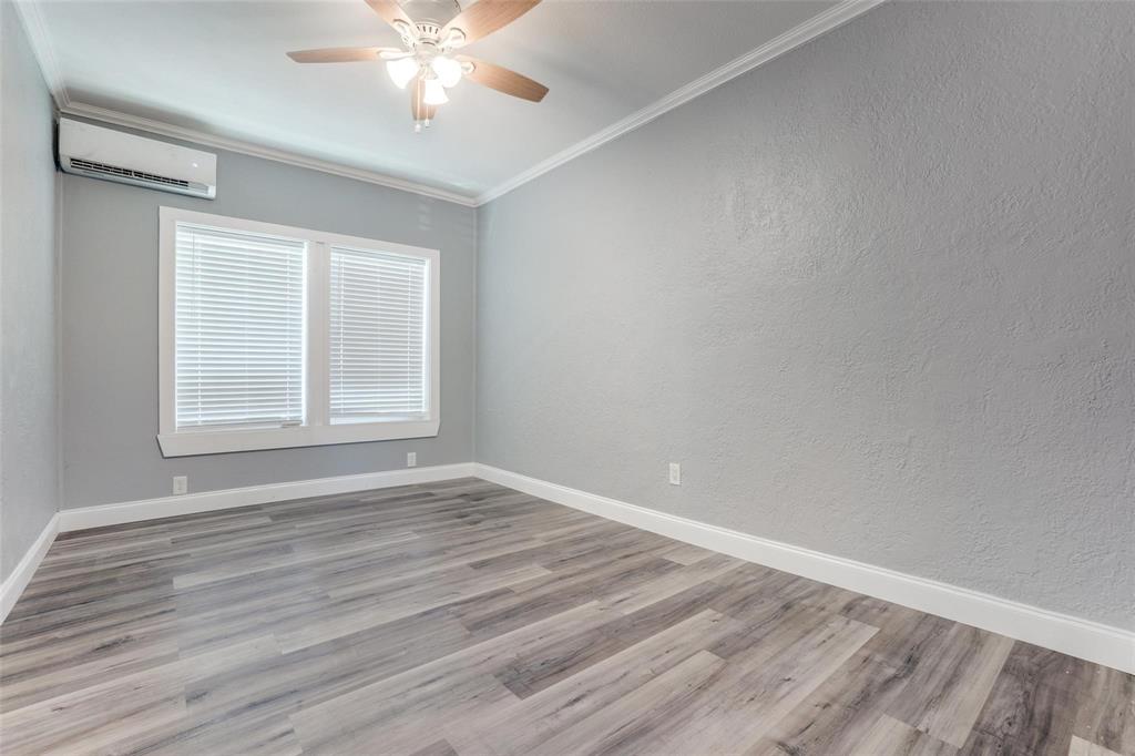 320 West Canty Street, Unit 2 Dallas, TX 75208 - Photo 10 of 11 wooden floor in an empty room with a window