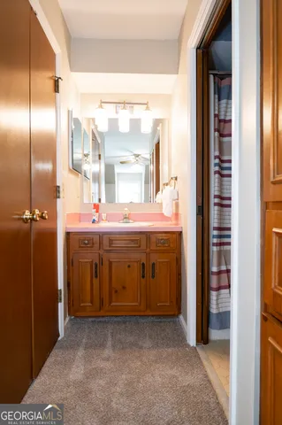 a bathroom with a toilet and a mirror