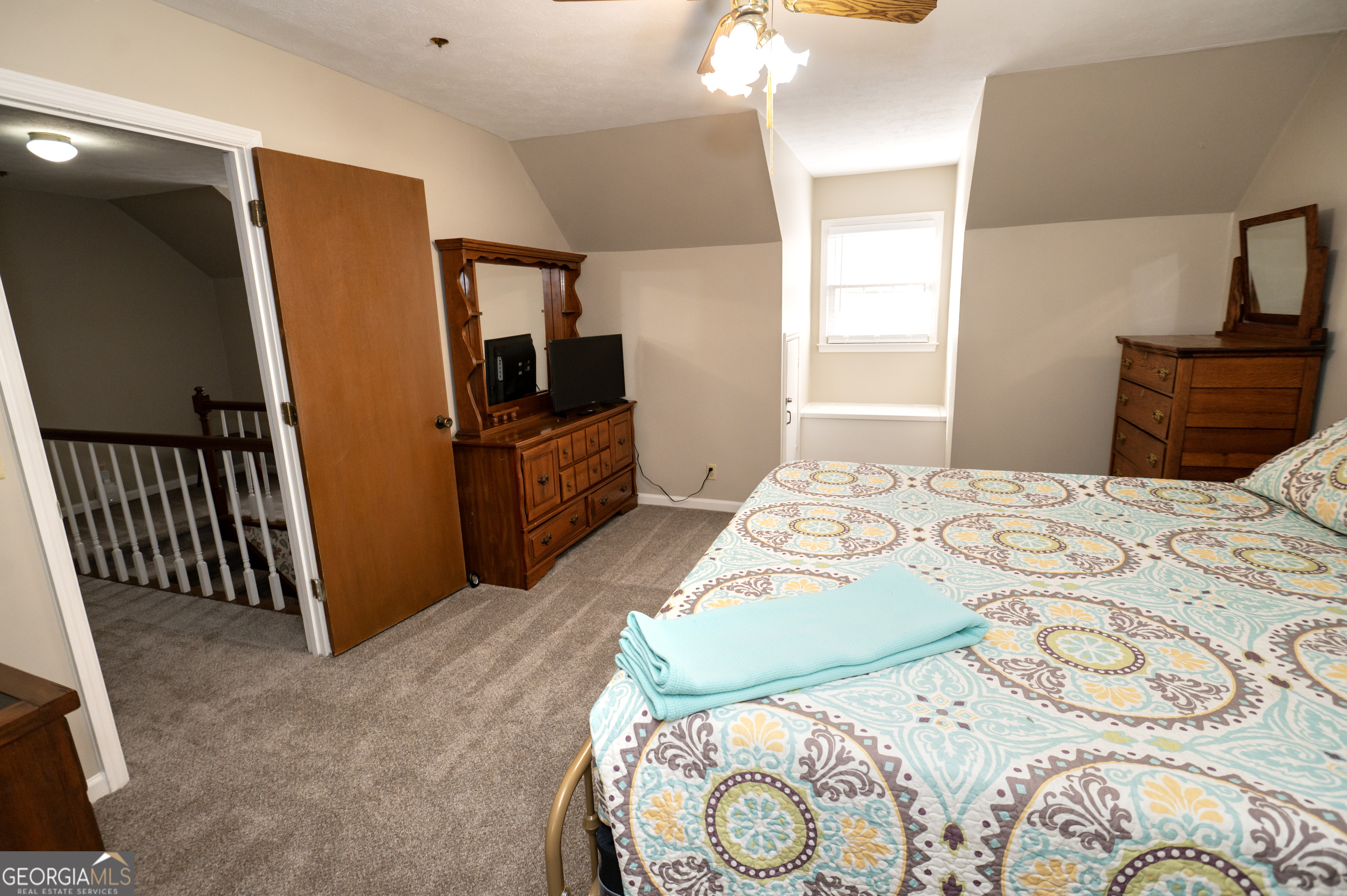 371 Mountain Hill Road Fortson, GA 31808 - Photo 18 of 42 a bedroom with a bed and wooden floor