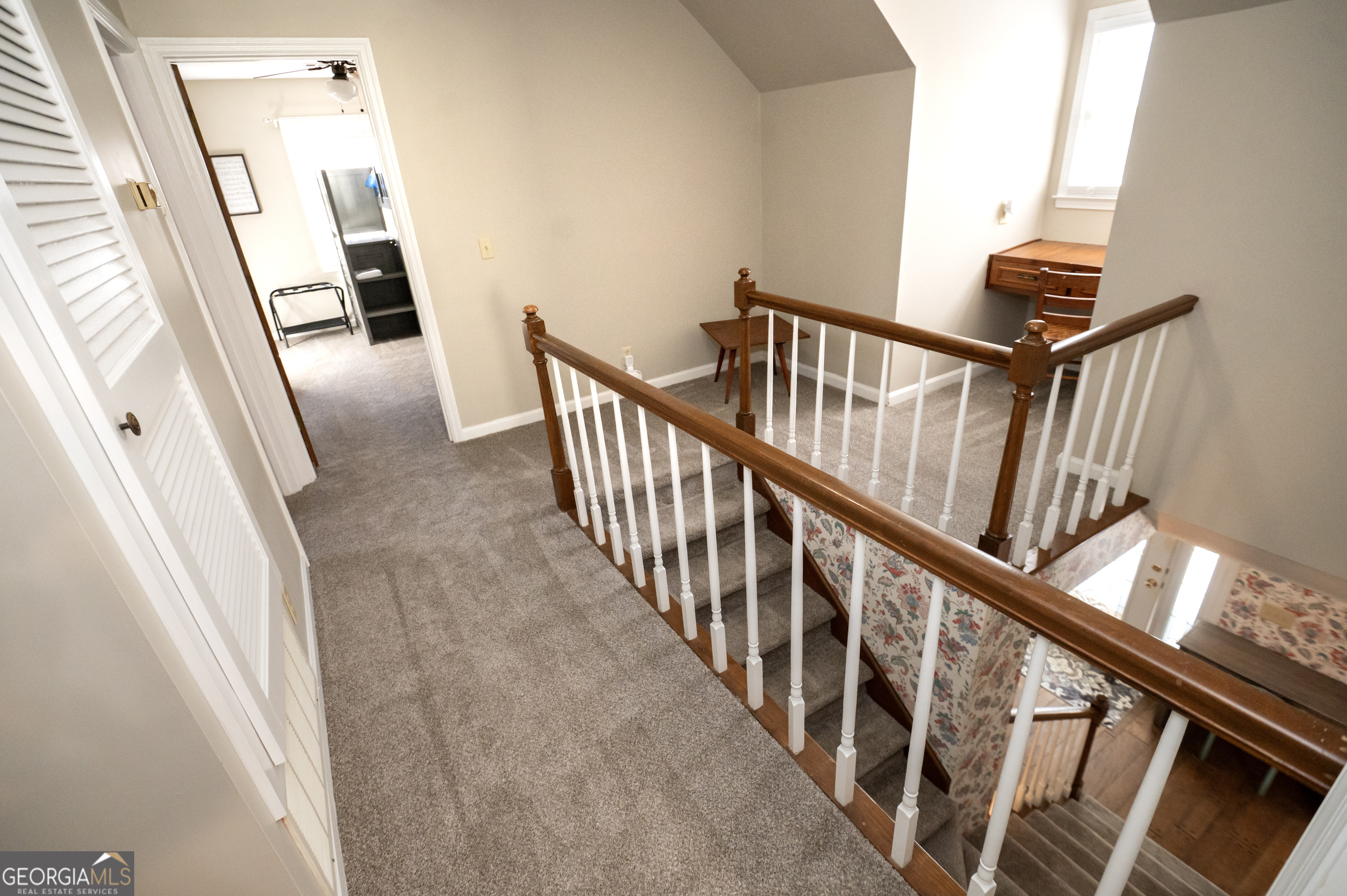 371 Mountain Hill Road Fortson, GA 31808 - Photo 19 of 42 a view of staircase with lots of frames on wall and windows