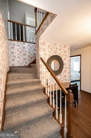 a view of a livingroom with furniture and wooden floor