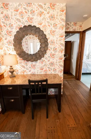 a large bed sitting in a bedroom next to a window