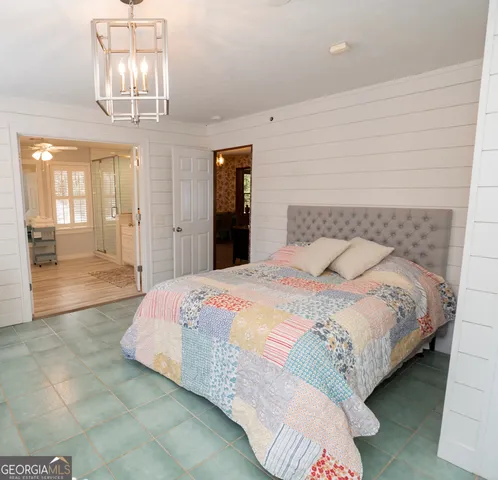 a bathroom with a sink a large mirror and a bathtub