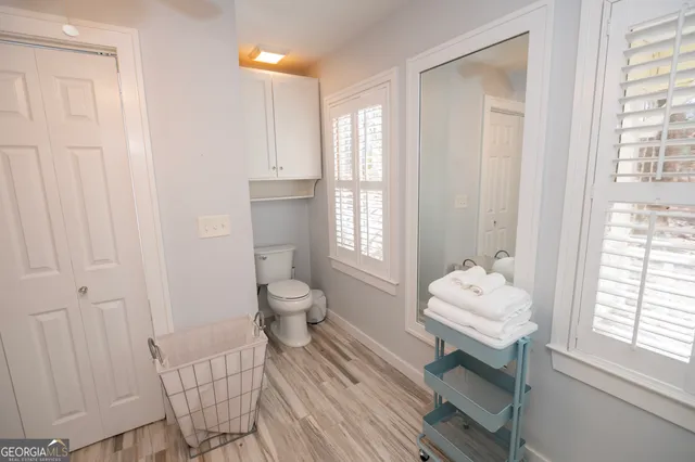 a bathroom with a shower a sink and a mirror