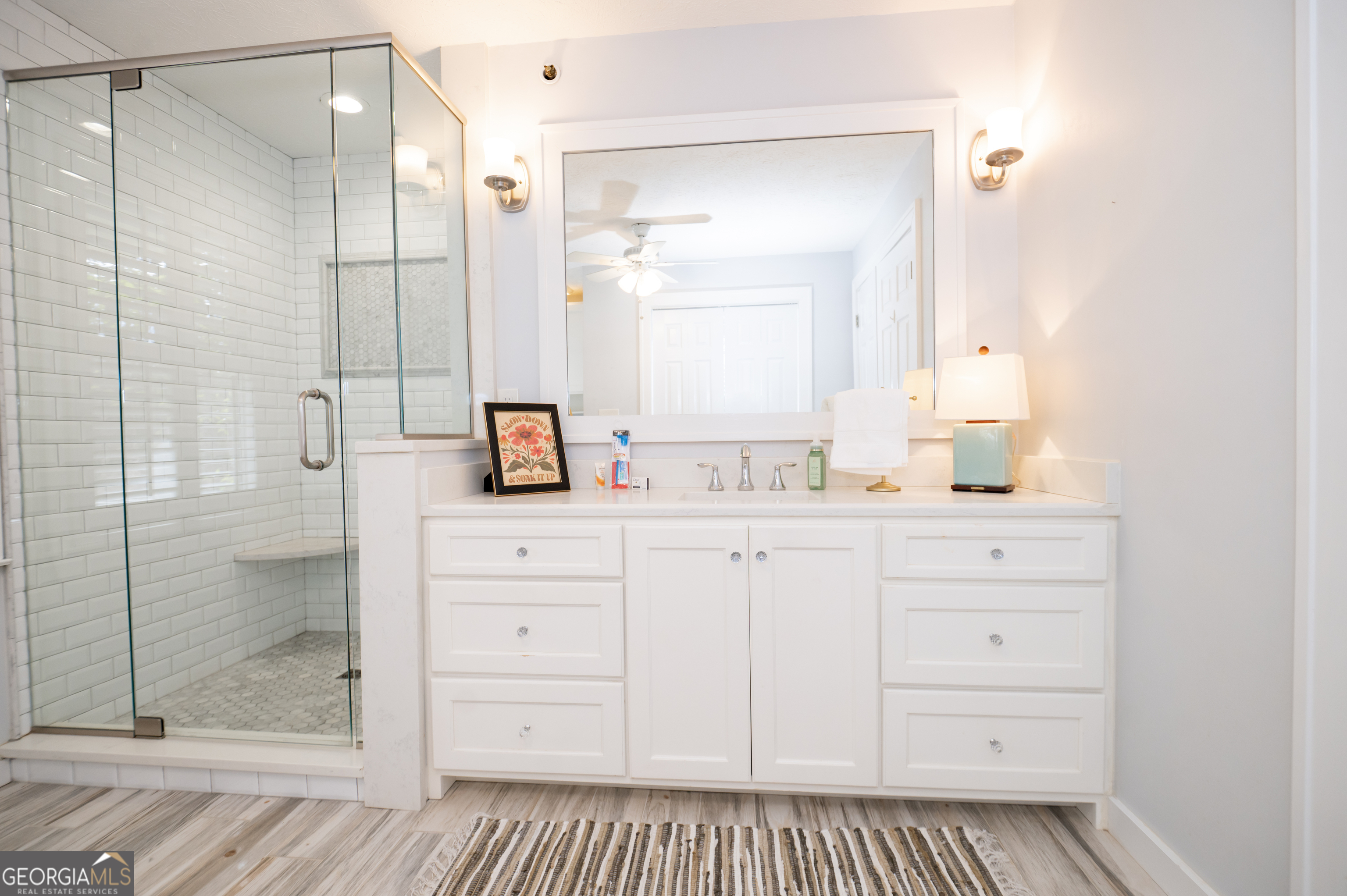 371 Mountain Hill Road Fortson, GA 31808 - Photo 28 of 42 a bathroom with a shower a sink and a mirror